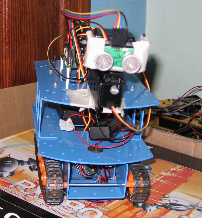 Two-tiered tracked robot with Ultrasonic sensor eyes