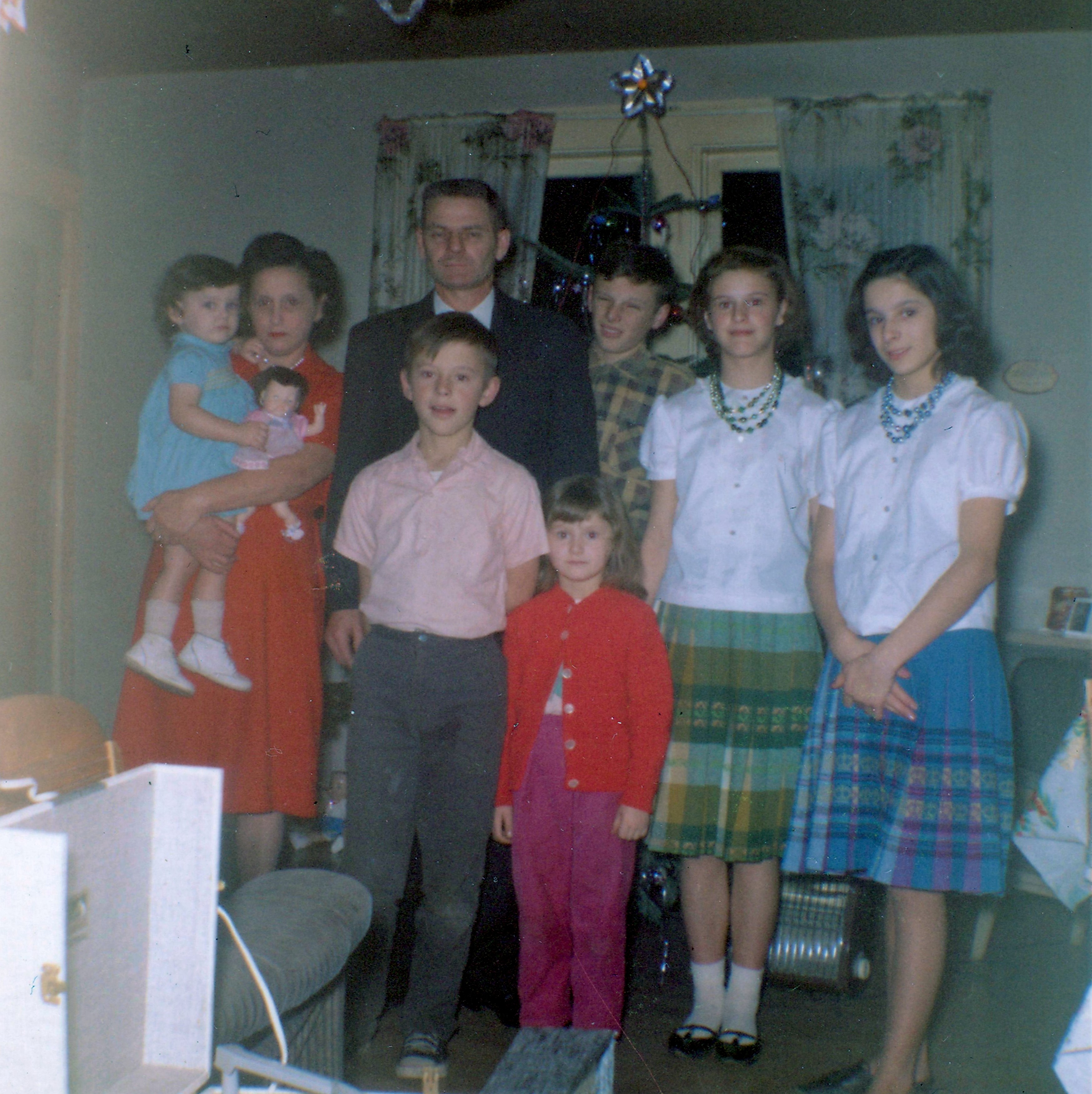 Christmas 1963, Ernie Frazer with his wife and six of his seven children. L to R, Karen Frazer, Christina Frazer, Ernie Frazer, Gary Frazer (in front of Ernie), Teresa Frazer, Donald Frazer (behind Teresa), Linda Frazer, and Dianne Frazer. Eldest daughter Sharon was taking the photo.